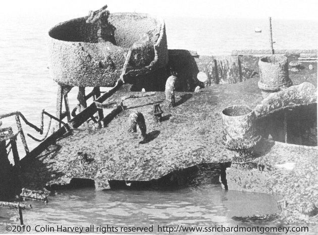 Gun turret on superstructure of Liberty ship SS Richard Montgomery wreck at low tide